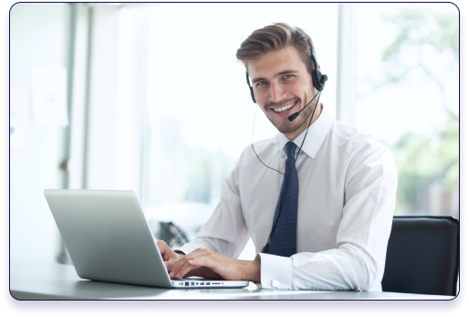 Skytek Telecom support agent wearing a headset while working at a laptop